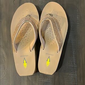 Volatile Tan Wedge Sandals with Thong Straps
Size 8
